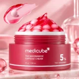Medicube TXA Niacinamide Capsule Cream jar with red capsules
